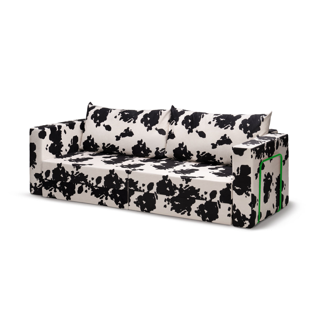 Flow Cow sofa bed in black-and-white cow print fabric with a green metal frame, angled front view