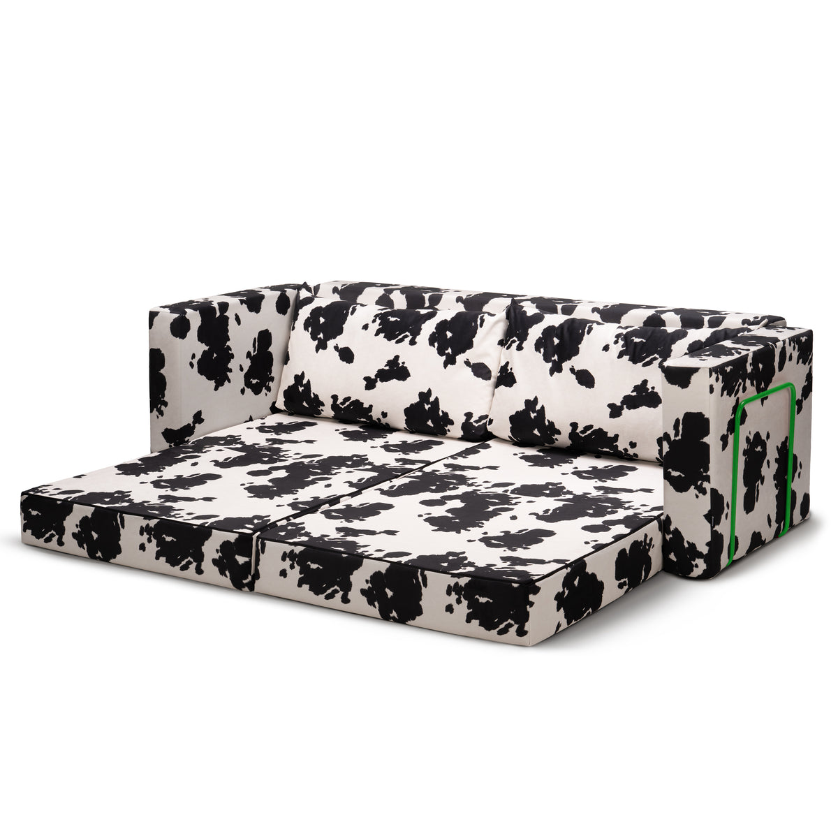 Flow Cow sofa bed in black-and-white cow print fabric with a green metal frame, unfolded into a 200 × 170 cm double bed