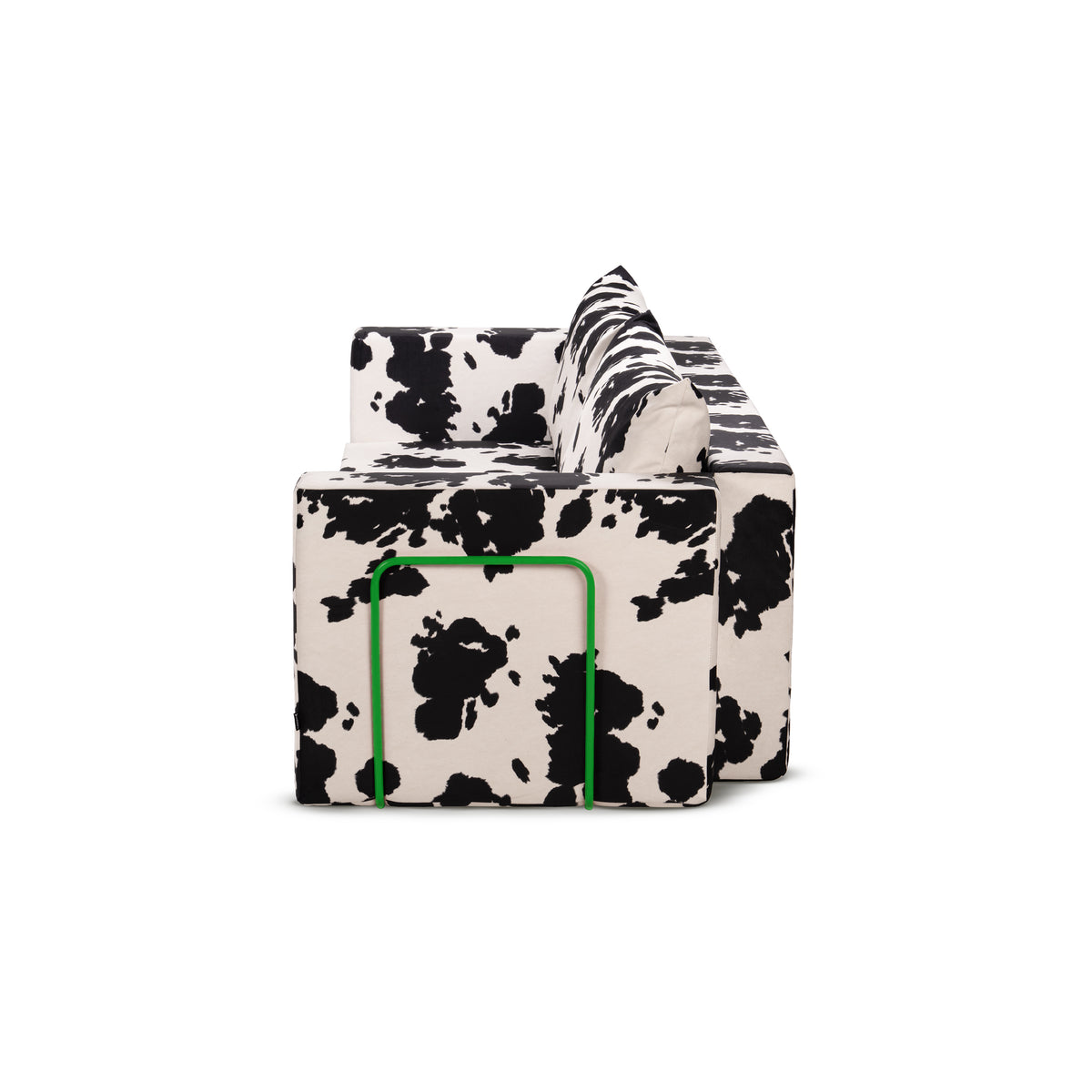 Flow Cow sofa bed in black-and-white cow print fabric with a green metal frame, side view